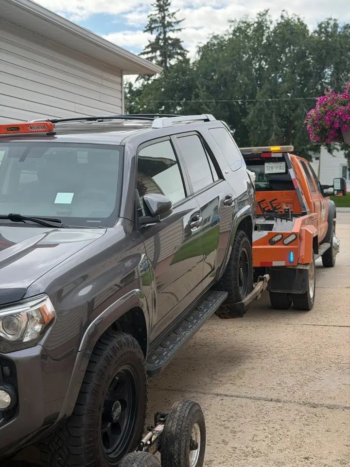 Force Towing truck transporting a customer vehicle