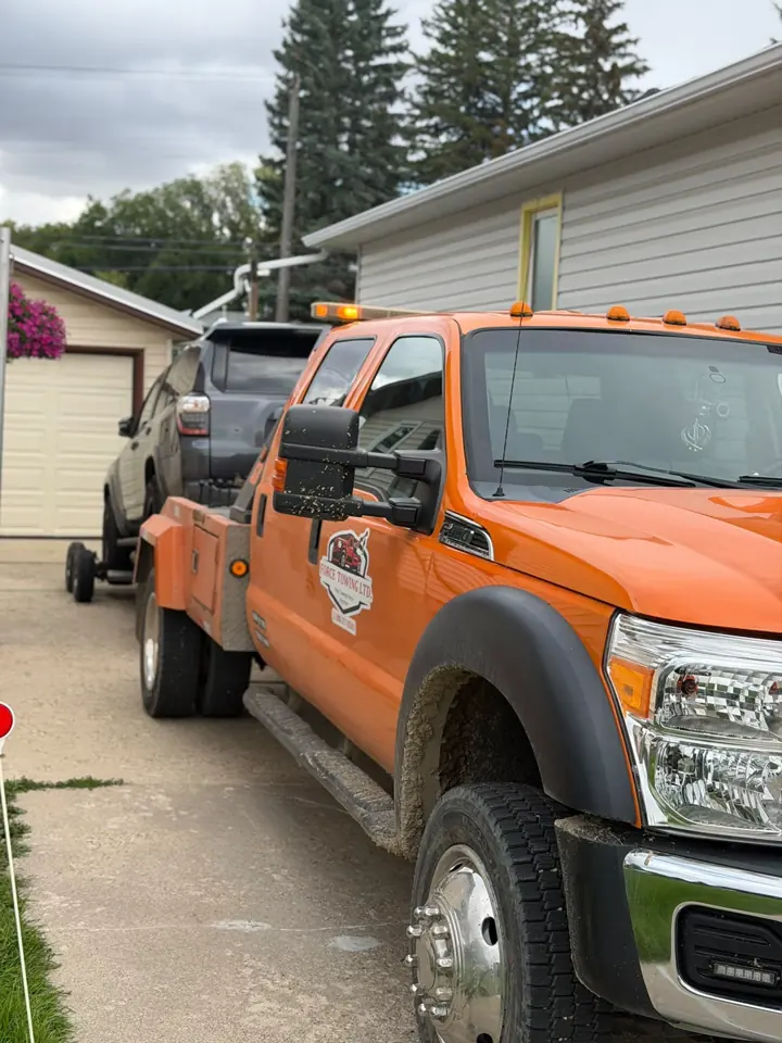 Force Towing truck transporting a customer vehicle