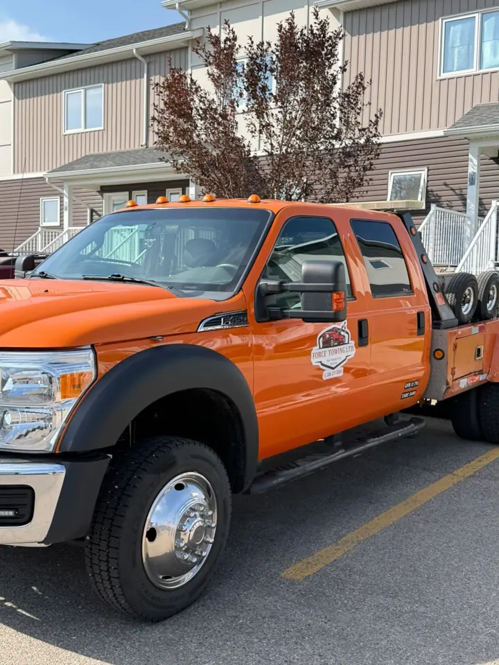 Force Towing truck transporting a customer vehicle