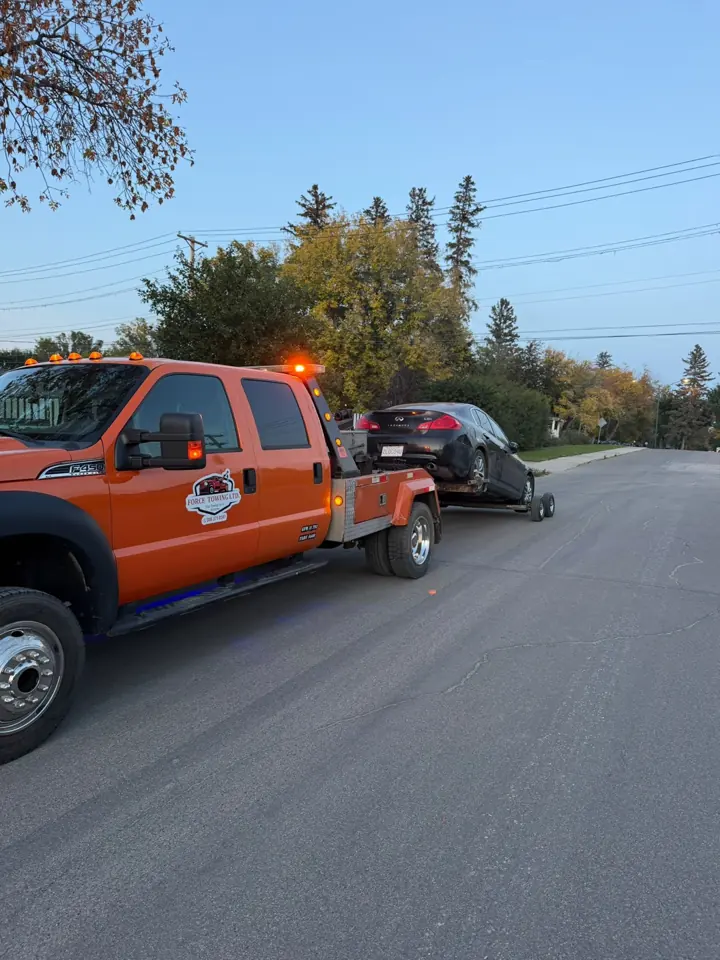 Force Towing truck transporting a customer vehicle