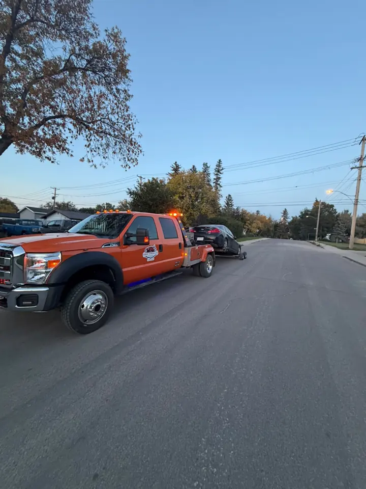 Force Towing truck transporting a customer vehicle