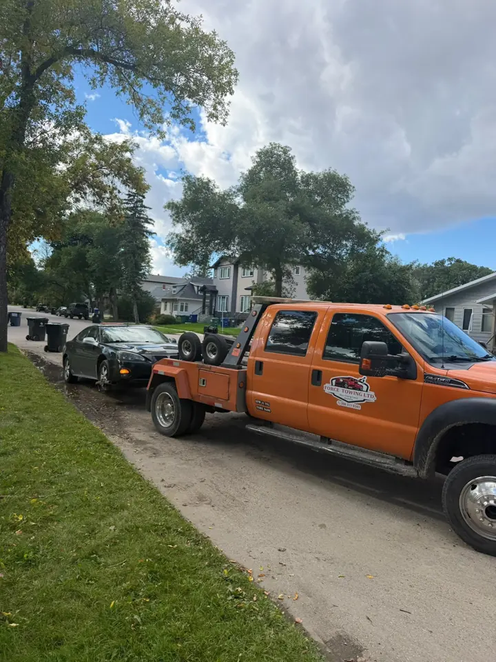 Force Towing truck transporting a customer vehicle